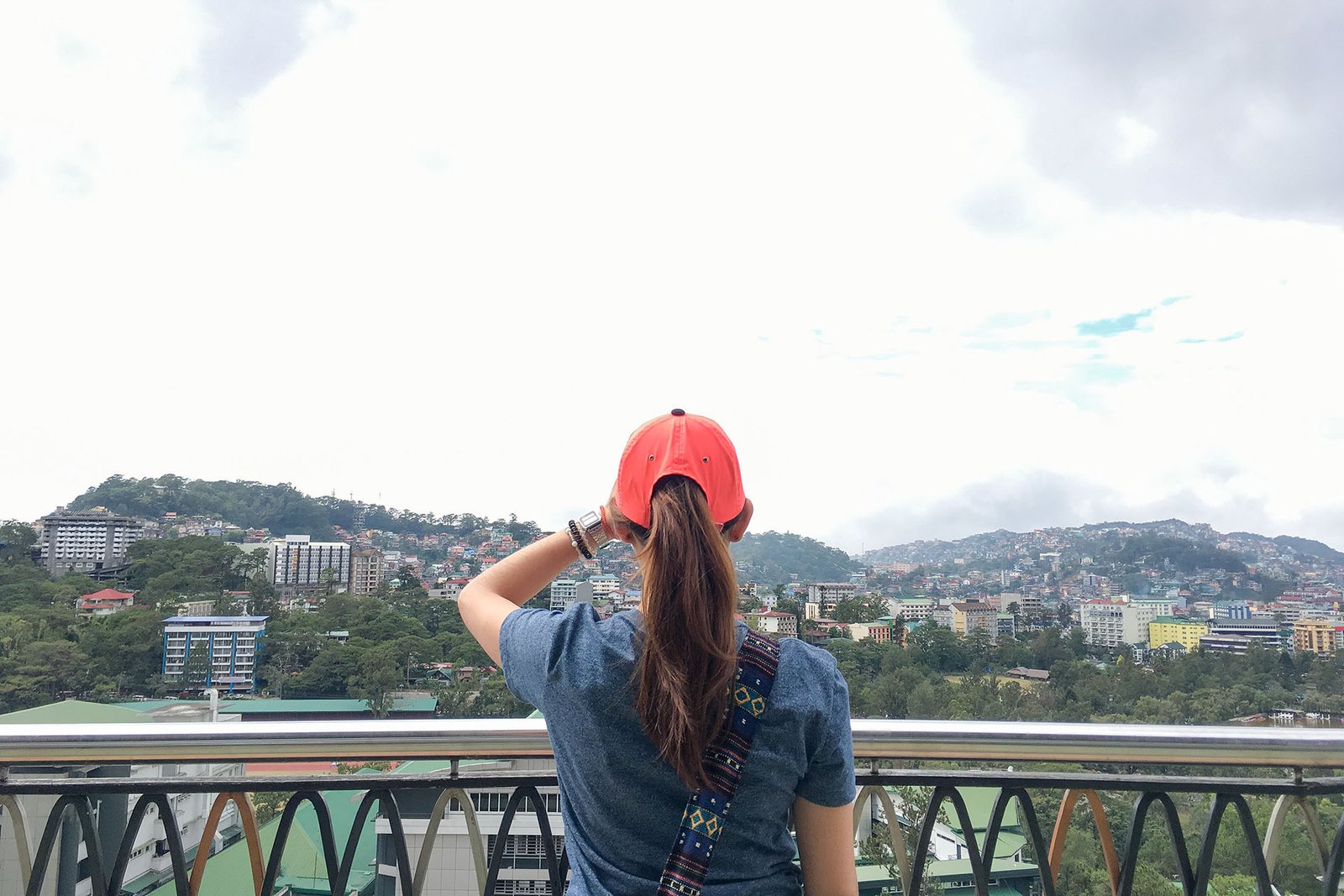 A woman overlooking Baguio City