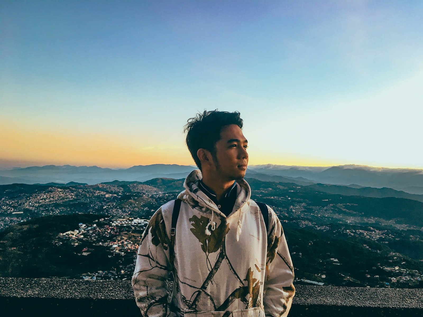 Photo of a man enjoying the view in Baguio City